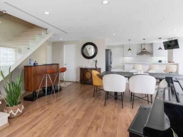 Aura Lofts: doble altura, fachada de cristal y recámara principal XL