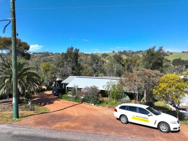 Backing onto the Avon River Just Moments from Town