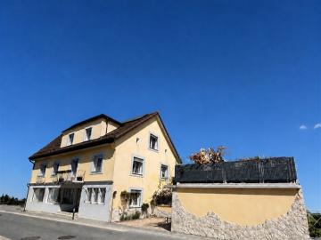 Bau von 2 Wohnungen, einem Geschäftsgebäude – 2 Schlafzimmer – 2 Parkplätze und einer Garage / Terrasse im Dorfzentrum