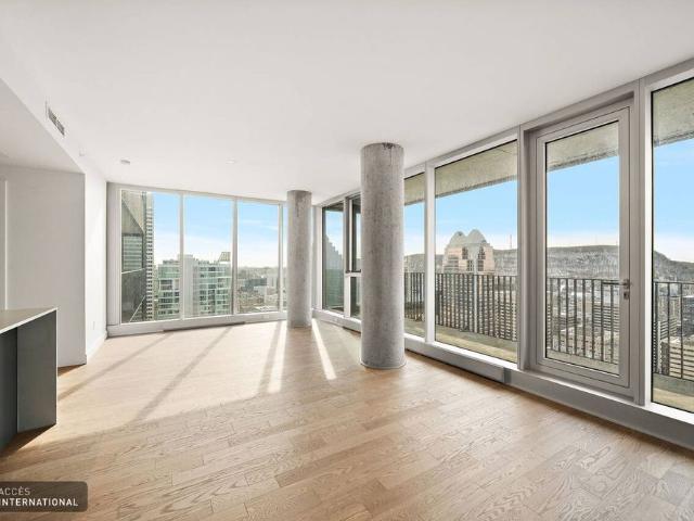 Beautiful corner apartment with one indoor parking space for rent in downtown Montreal
