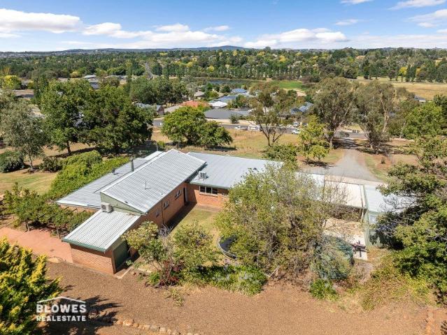 BEAUTIFUL HOME ON LARGE ELEVATED BLOCK WITH VIEWS!