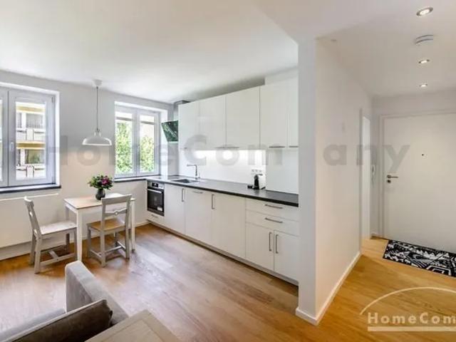 Beautiful newly renovated and furnished 2 room flat with large covered balcony furnished with pretty garden furniture in Maxvorstadt