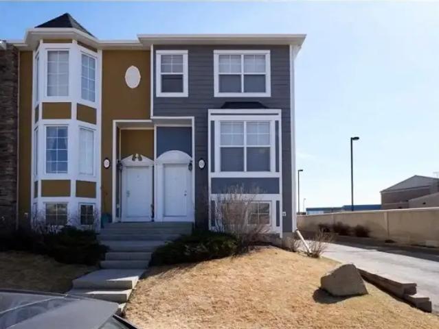 Beautiful townhouse in the desired community of Rainbow Falls, Chestermere. — 2 Bedrooms+ Den Townhouse