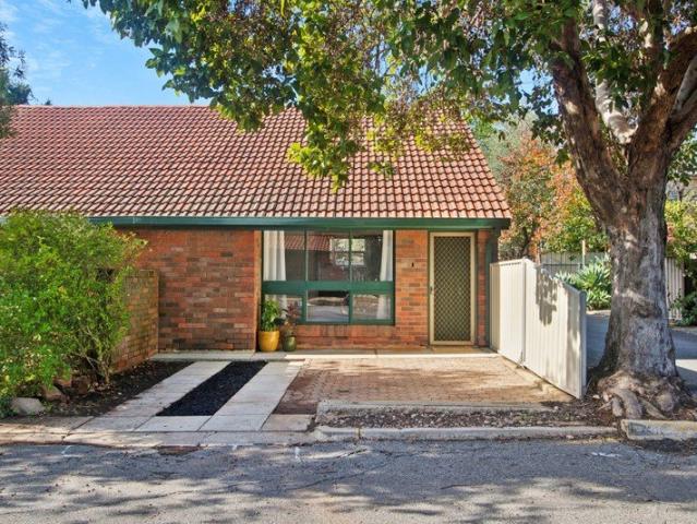 Beautifully Updated, Easy Care Living in a Blue Chip Near City Location