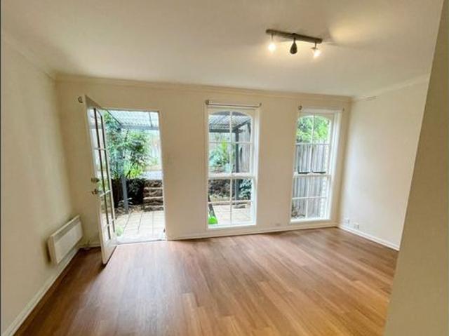 Beautifully Updated 2 Bedroom Townhouse with Secure Garage, Storage & All Weather Entertaining