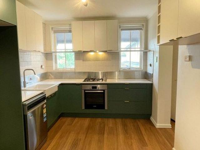 Beautifully Updated 2 Bedroom Townhouse with Secure Garage, Storage & All Weather Entertaining