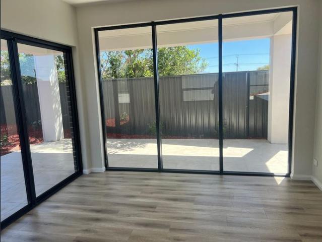 Beautifully Designed Near New Modern Home with Low Maintenance Yard