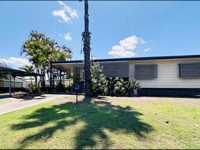 BEAUTIFULLY MAINTAINED HOME ON A SPACIOUS CORNER BLOCK