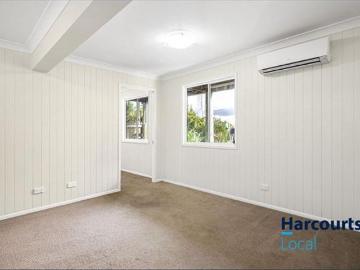 Beautifully Presented 5 Bedroom Queenslander With Dual Living Potential & Stunning Front Deck