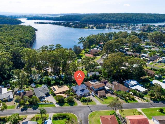 Beautifully Presented Coastal Living with Stunning Burrill Lake Views
