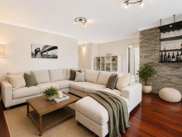 Beautifully presented executive apartment with garage