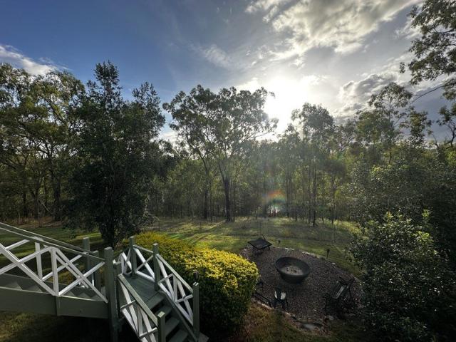 Beautifully presented Queenslander, set on 25 acres, perfectly positioned to capture elevated, uninterrupted views over endless bushland