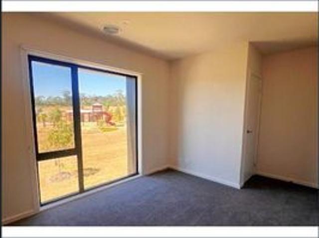 Beautifully Presented Townhome – Park facing, 4 Bedroom with open plan living, courtyard area and double remote garage