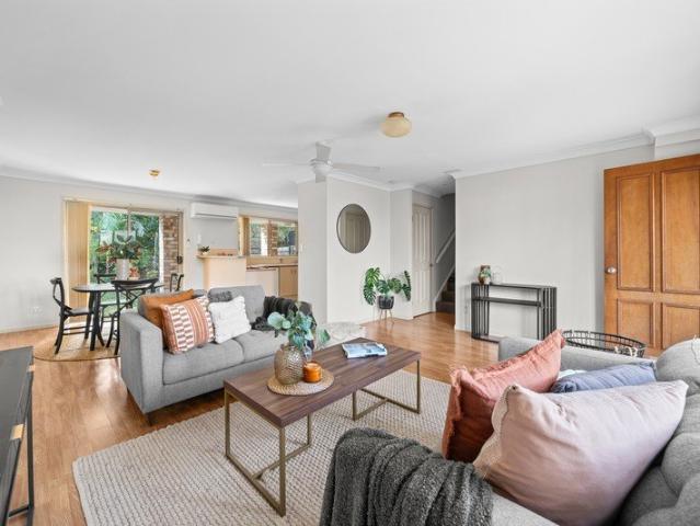 BEAUTIFULLY PRESENTED TOWNHOUSE WITH A LARGE YARD!