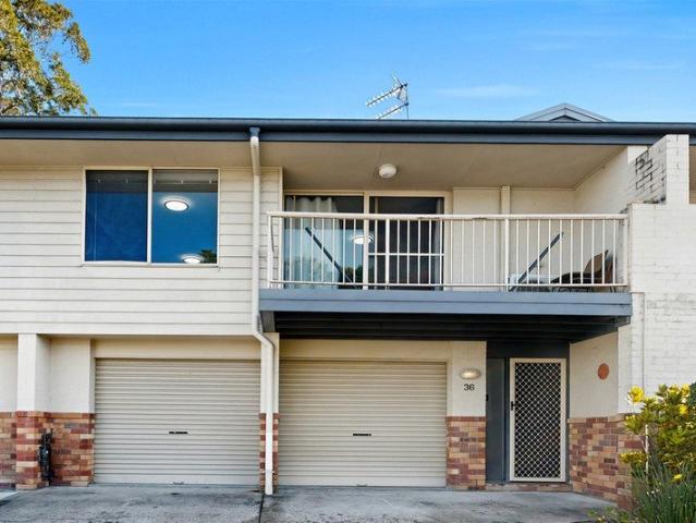 Beautifully Presented Townhouse with Double Garage & 4 Car Parking