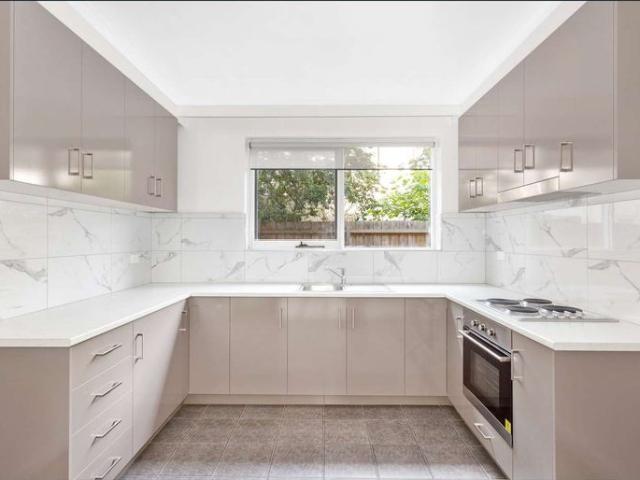 Beautifully Renovated Ground floor Apartment with 2 Balconies & 2 car spots