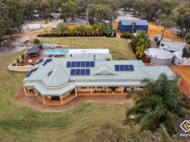 Beautifully Renovated Family Acreage with Resort Style Living