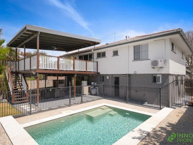 Beautifully Renovated High Set Family Home With Versatile Living Areas, A Sparkling Pool & Expansive Outdoor Entertaining!