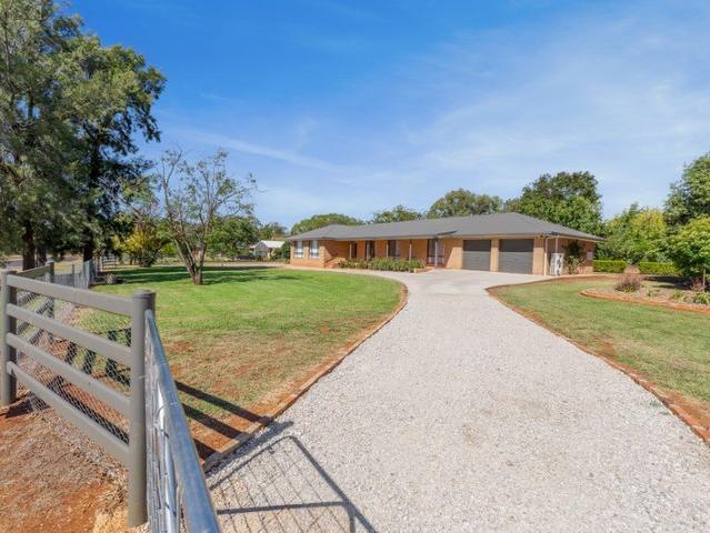 Beautifully Renovated on a Full Acre