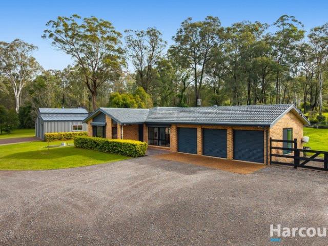 Beautifully renovated on two manicured acres