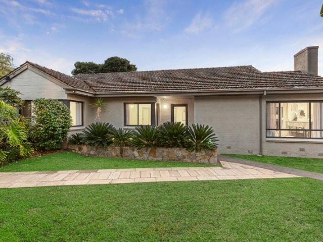 Beautifully Renovated Single Level Living with Poolside Enjoyment