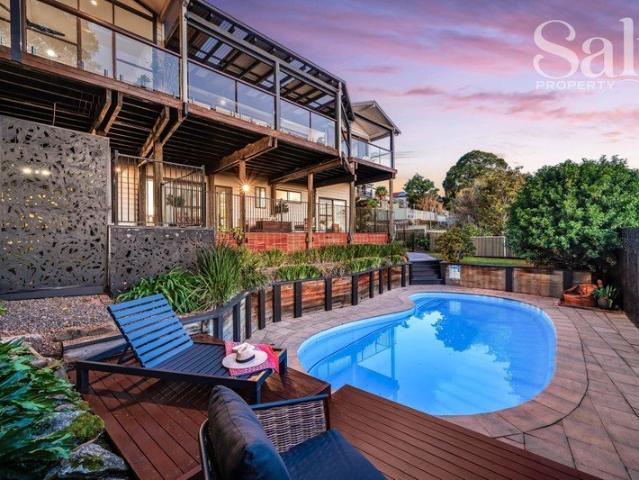Beautifully renovated, wonderfully spacious & backdropped by stunning lake views