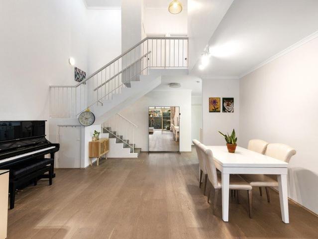 Beautifully renovated townhouse with house like appeal in an exclusive village setting