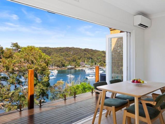 Beautifully renovated top floor coastal sanctuary with uninterrupted North Harbour views