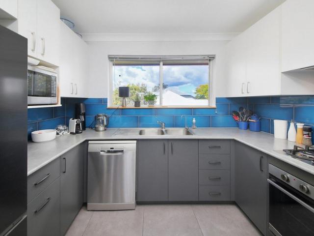 Beautifully renovated top floor unit with views