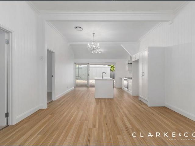 BEAUTIFULLY RENOVATED THREE BEDROOM CHARACTER HOME WITH REAR LANE ACCESS!