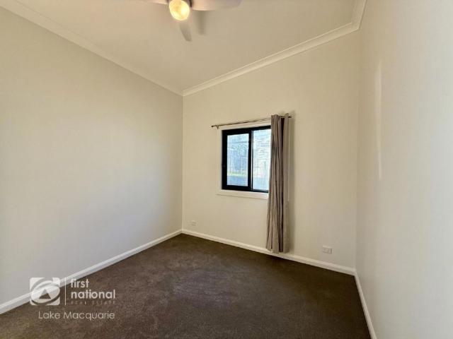 Beautifully Renovated Two Bedroom Unit with rear deck overlooking the backyard