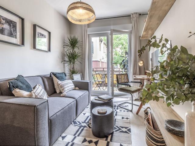 Beach Themed 1 Bedroom Apartment with Terrace and Workspace in Almagro, Madrid Amsterdam Apartments for Rent