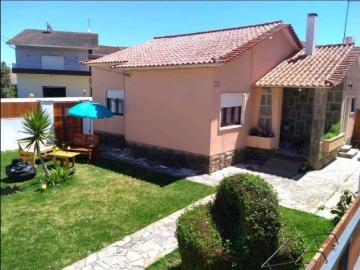 Beach house with a garden