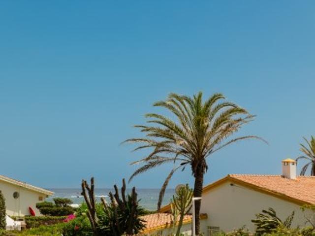 Beachfront 4 bedroom holiday villa with private garden in Costabella, Marbella East