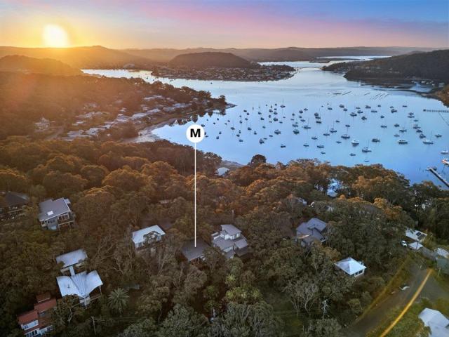 Beachside bliss, immersed in ocean and bay vistas and wrapped by Bouddi National Park