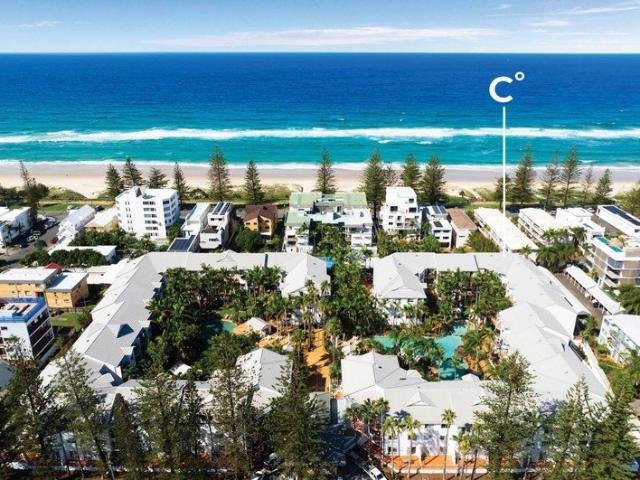 Beachside Living with Ocean Glimpses & Endless Potential