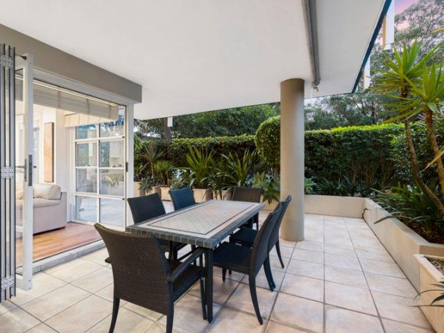 Beachside retreat with sun drenched wraparound terrace and private Street access