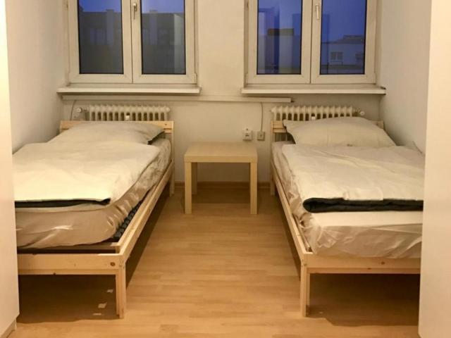 Bed in a cosy twin bedroom, in trendy Tiergarten district