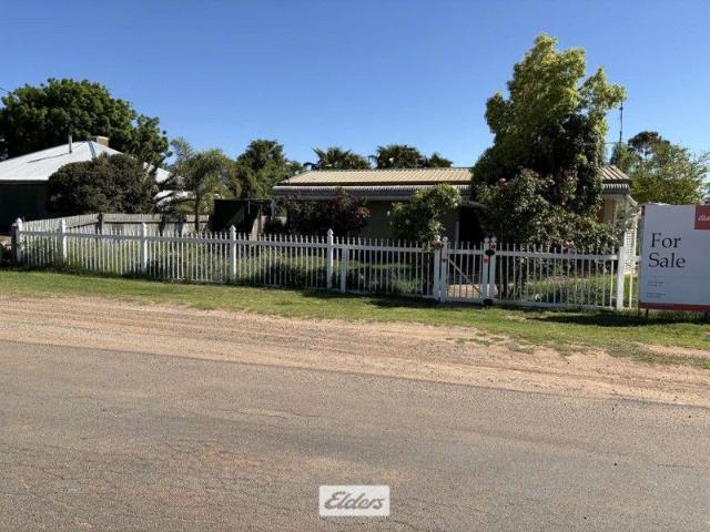 Behind the white picket fence