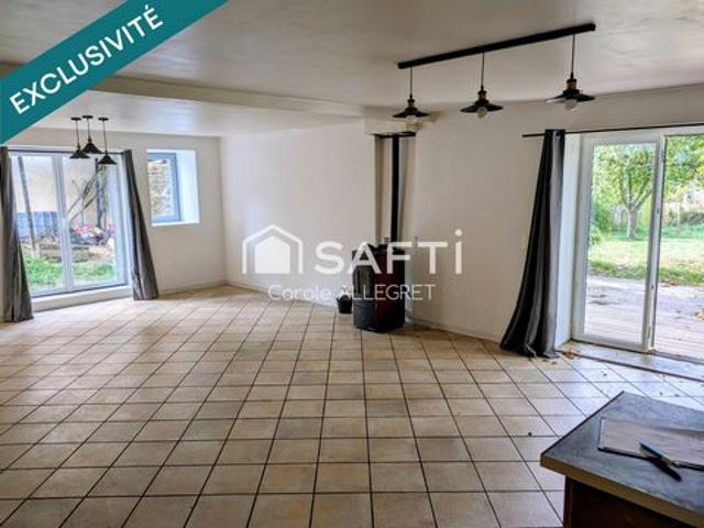 Belle grande maison atypique avec garage et terrain arboré