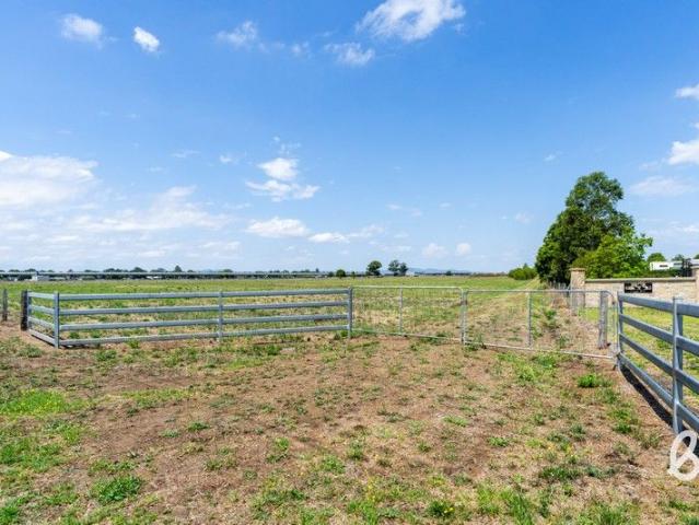 Best of acreage living with town services and immediate build ready appeal