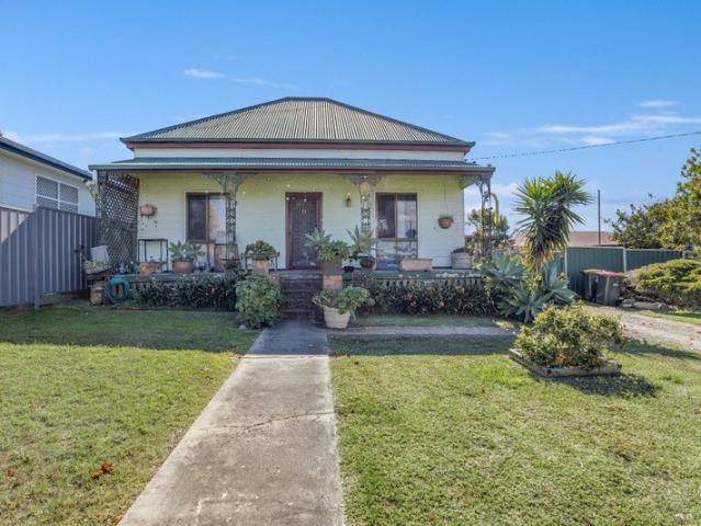 Big Block, Great Location & Plenty of Potential!