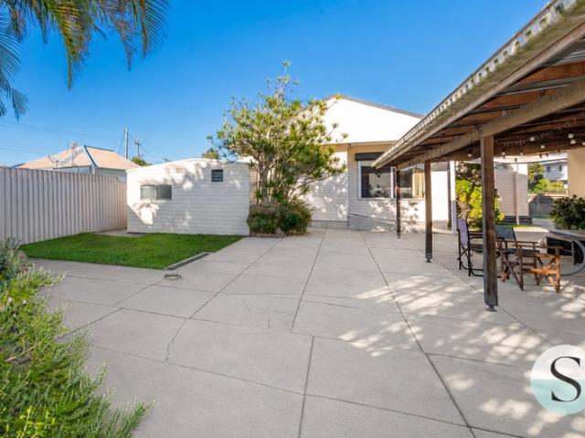 Big on Charm, Small on Price, Side Drive Access to Wonderfully Easy Care Grounds & Massive Garaging, Light, Bright, Renovated Interior!