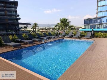 Bornova Latif Aydemir Business'da Sıfır Eşyalı 1+1 Kiralık Daire