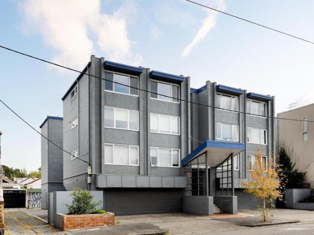 Boutique top floor apartment in an ultra convenient Carlton North position