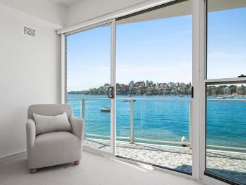 'Broadwaters' – Sun filled three bedroom, two bathroom absolute waterfront strata apartment in a prized north east corner position