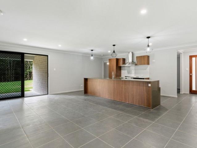 Brand New Home in the Heart of Springbrook with Solar and Large Yard