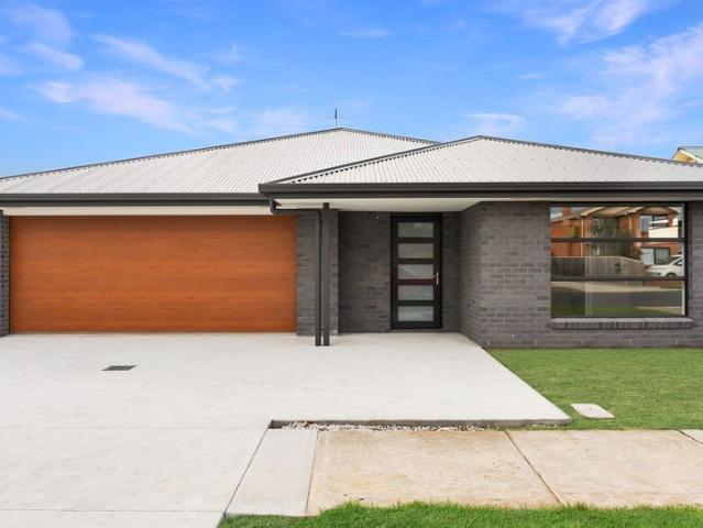BRAND NEW LIVING WITH LOW MAINTENANCE APPEAL
