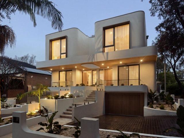 Brand new luxurious tri level residence with resort style modernism in an exclusive setting