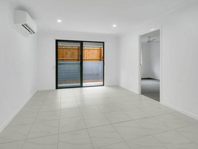 BRAND NEW MODERN LIVING WITH FENCED BACKYARD!